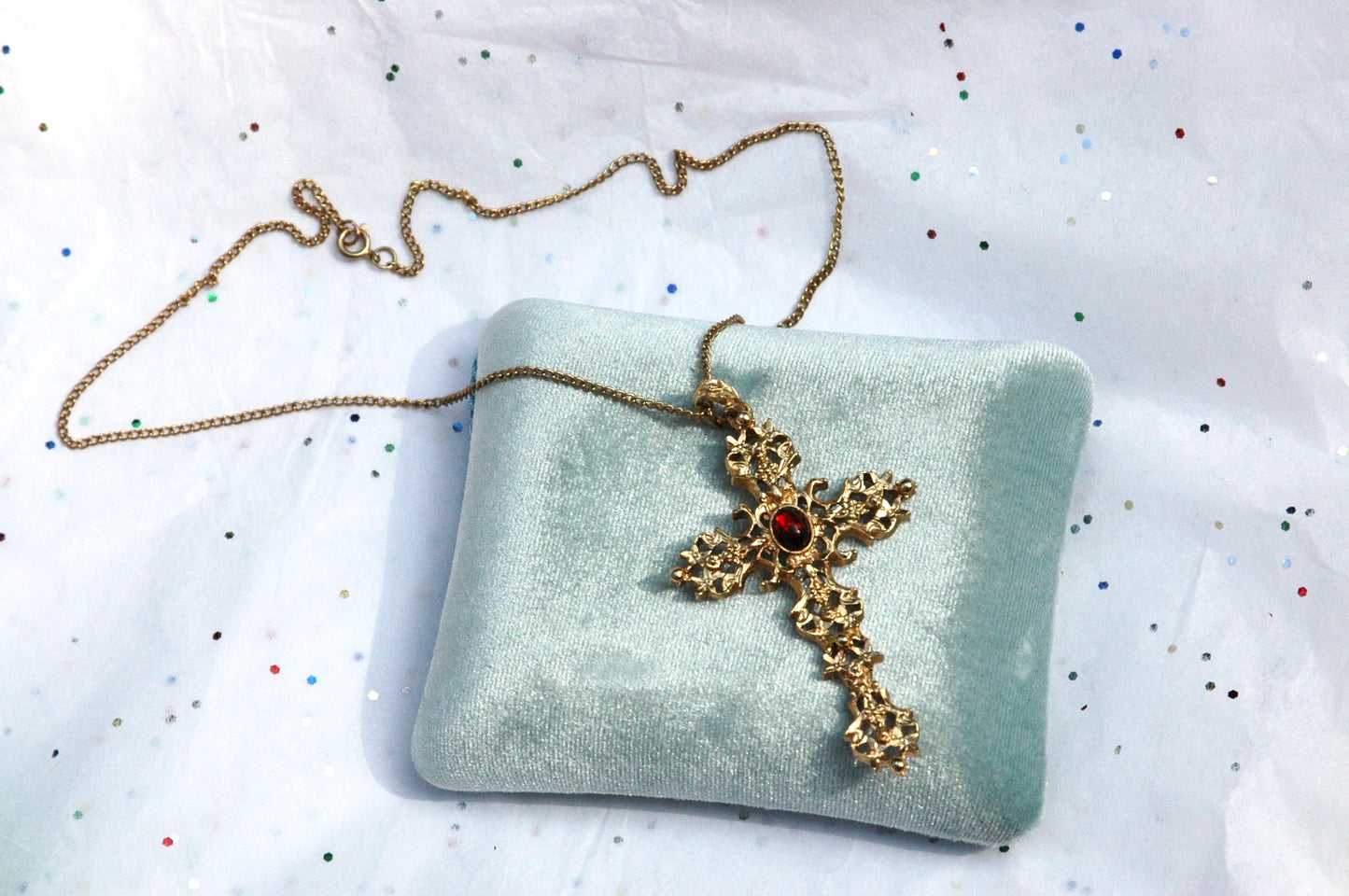 Vintage Avon Gold Tone Ornate Cross Necklace with Red Gemstone