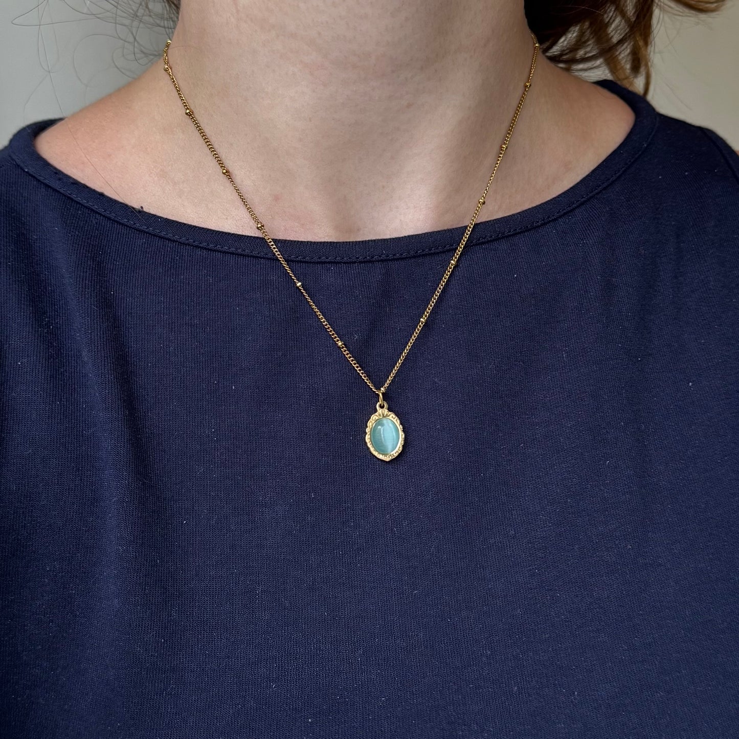 Gold Engraved Bezel Pendant Necklace with Blue Cabachon Stone