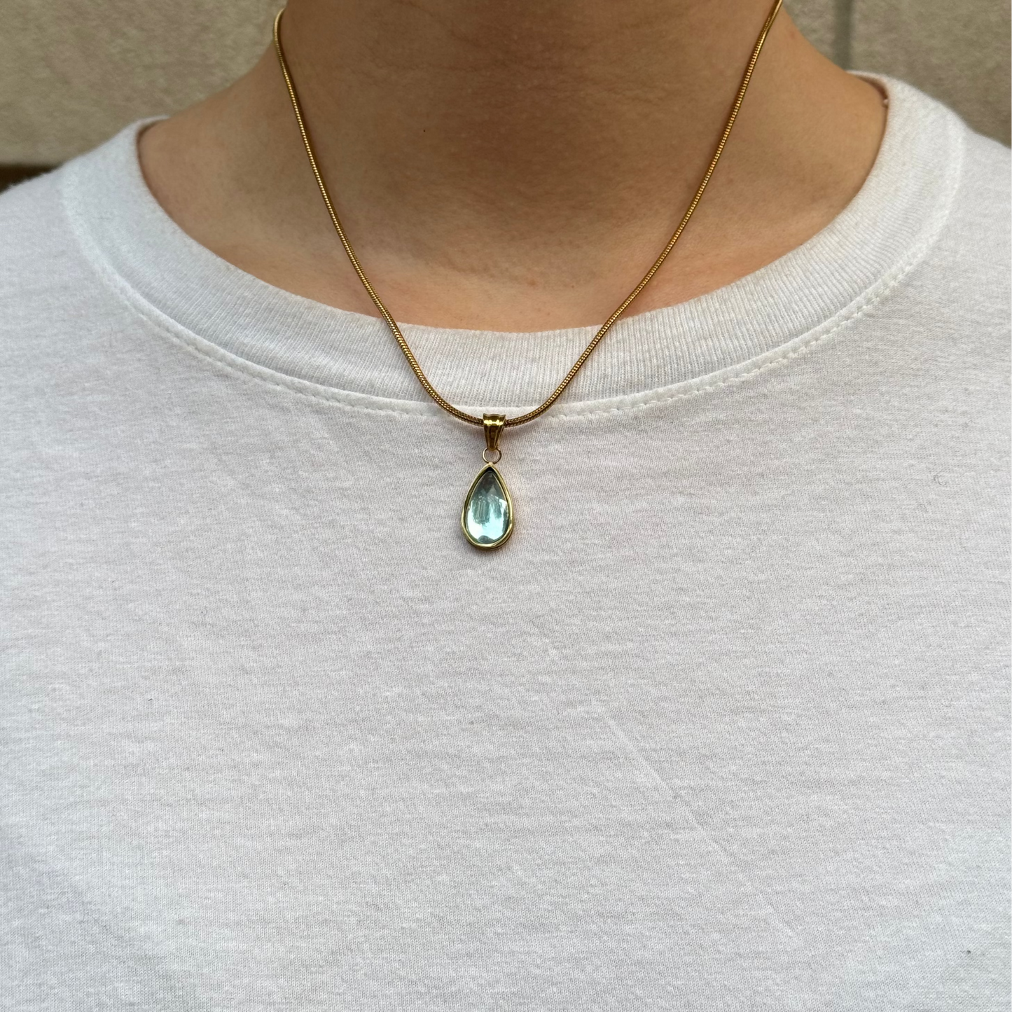 Gold Pendant Necklace with Blue Teardrop Stone