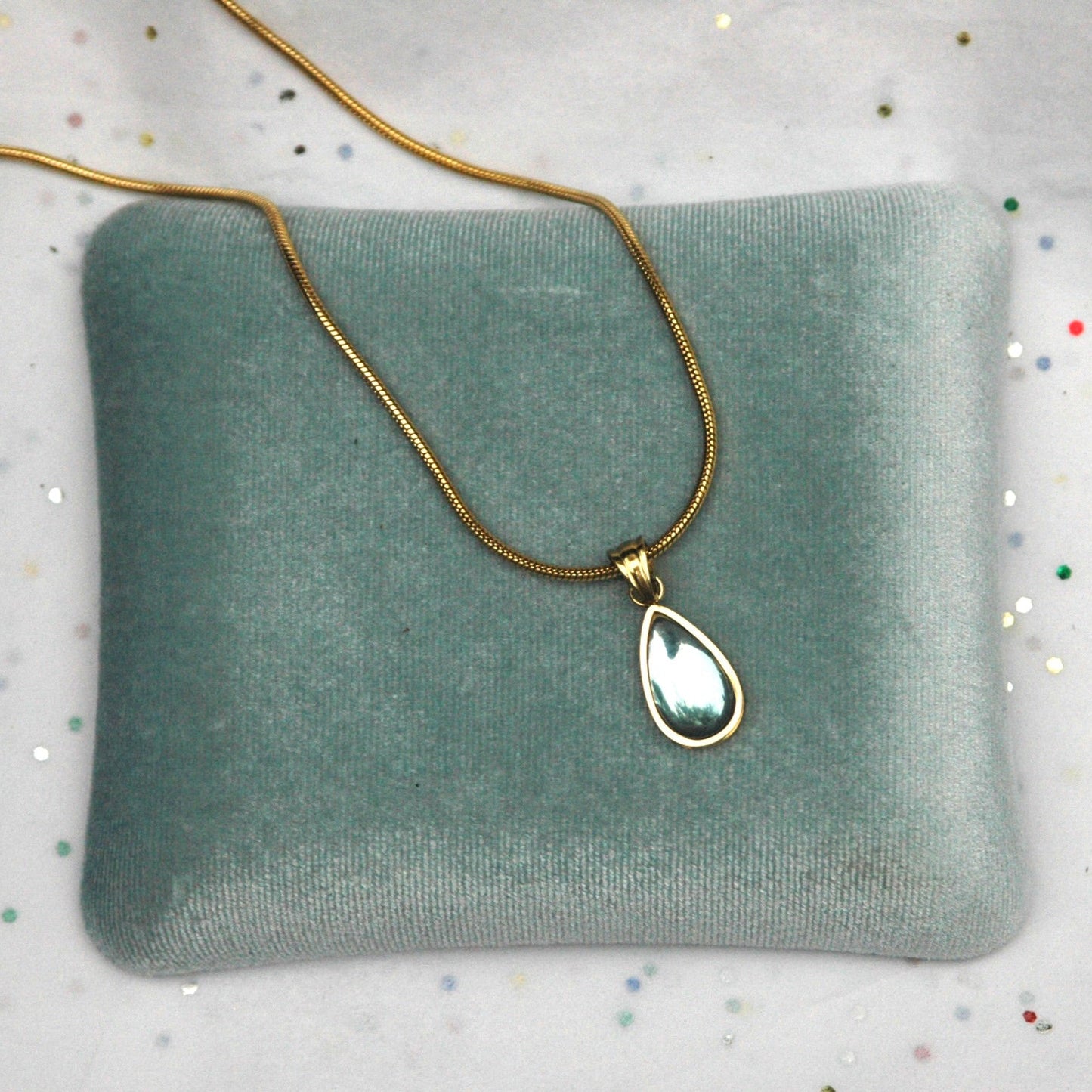 Gold Pendant Necklace with Blue Teardrop Stone