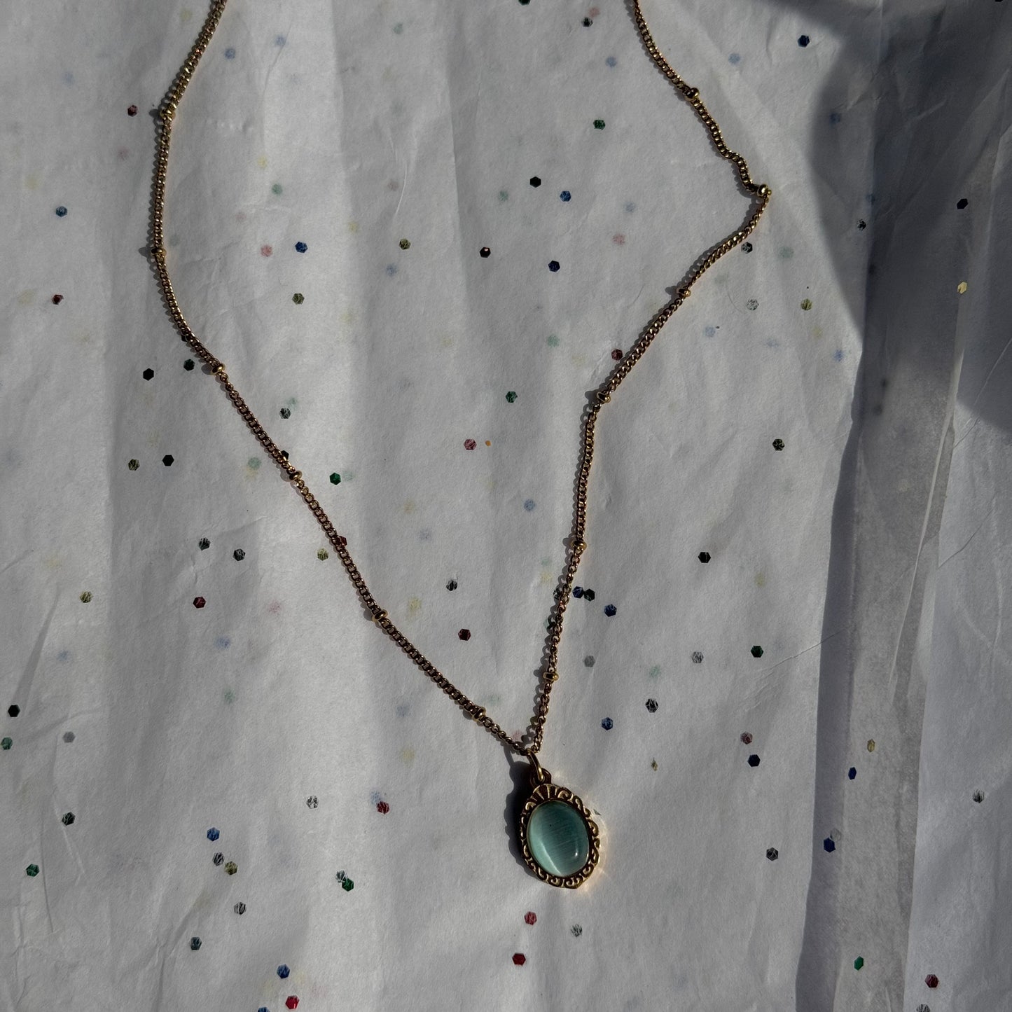 Gold Engraved Bezel Pendant Necklace with Blue Cabachon Stone