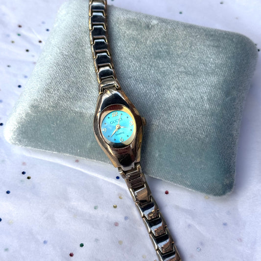 Vintage Gucci Silver and Gold Bubble Watch with Teal Face