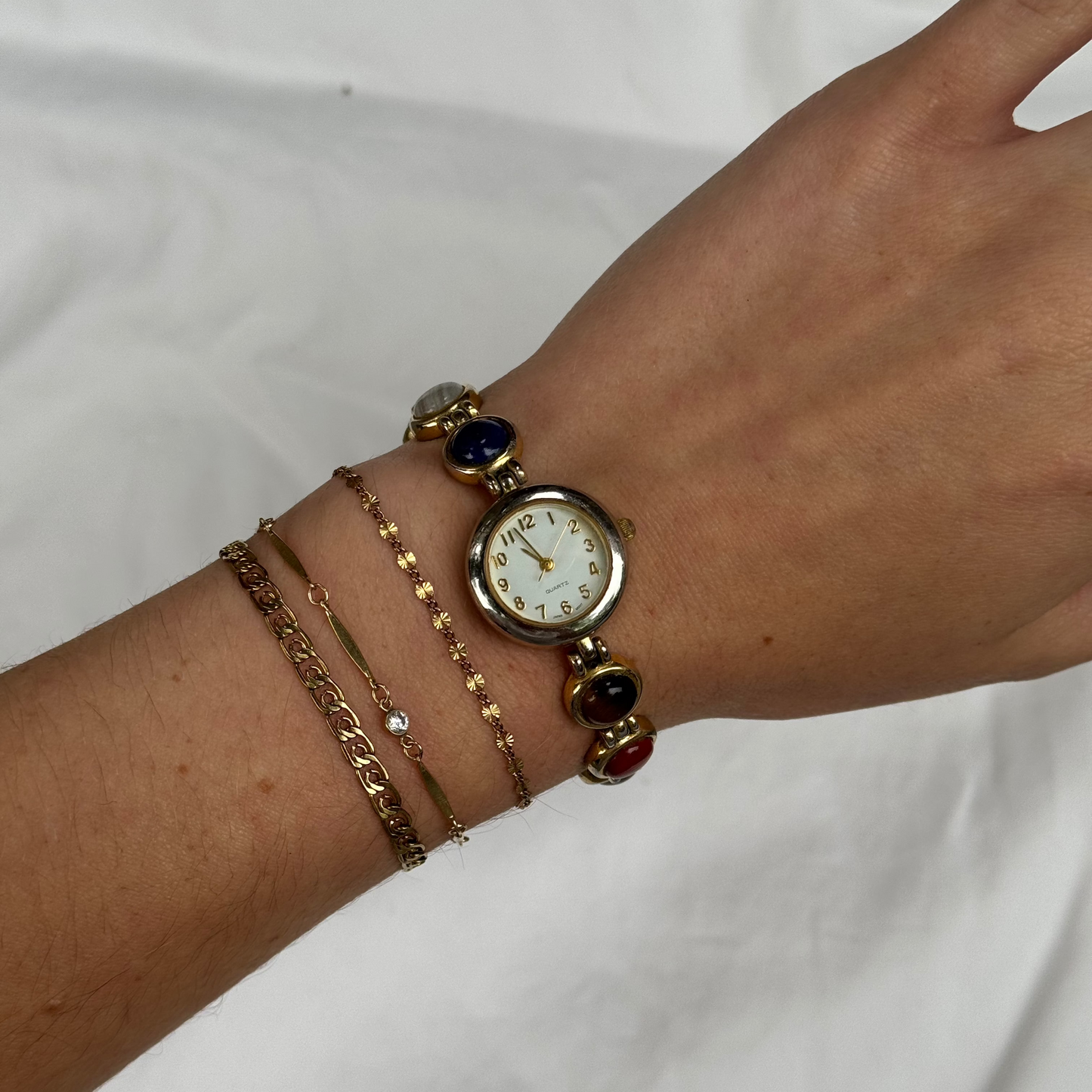 Vintage Gold Tone Watch with Multicolored Stones